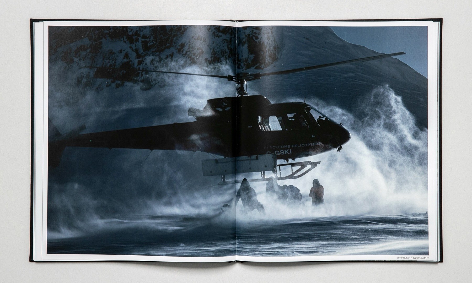 Open spread: a helicopter hovering low over rough water